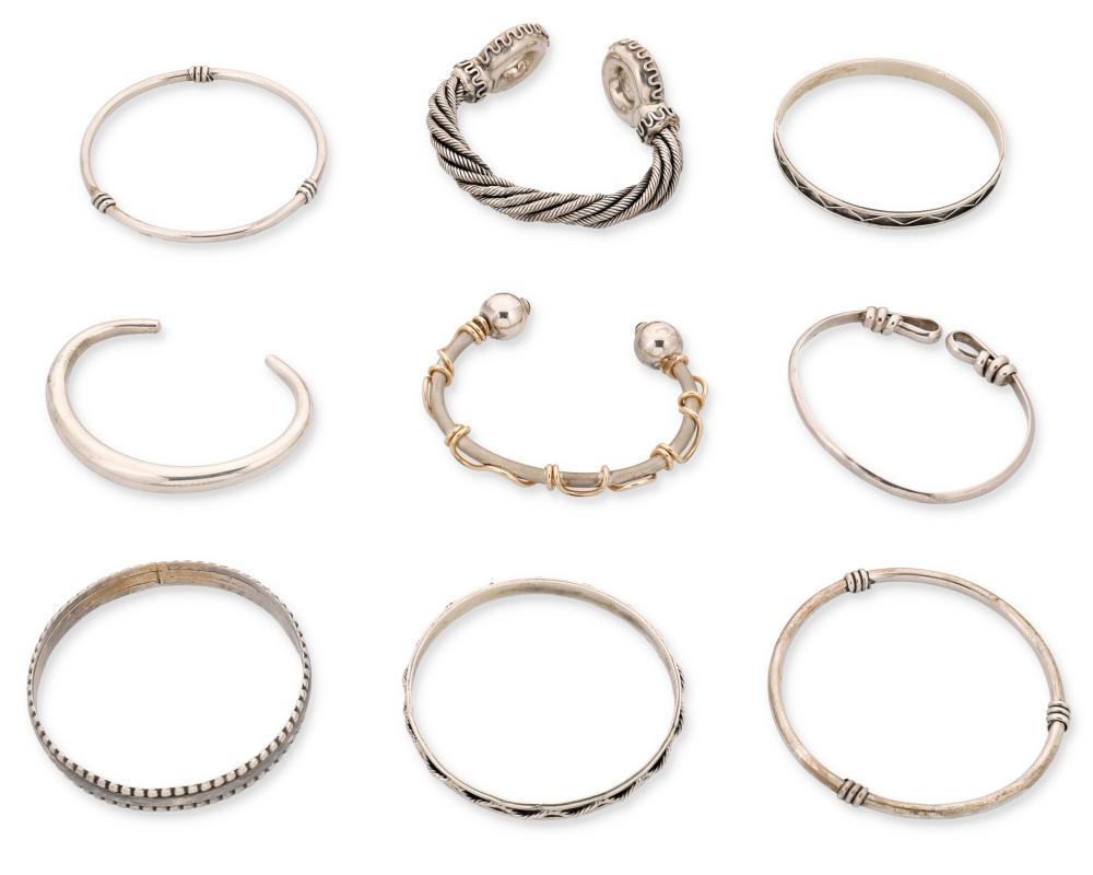 A GROUP OF SILVER BRACELETSA