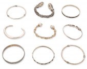 A GROUP OF SILVER BRACELETSA g