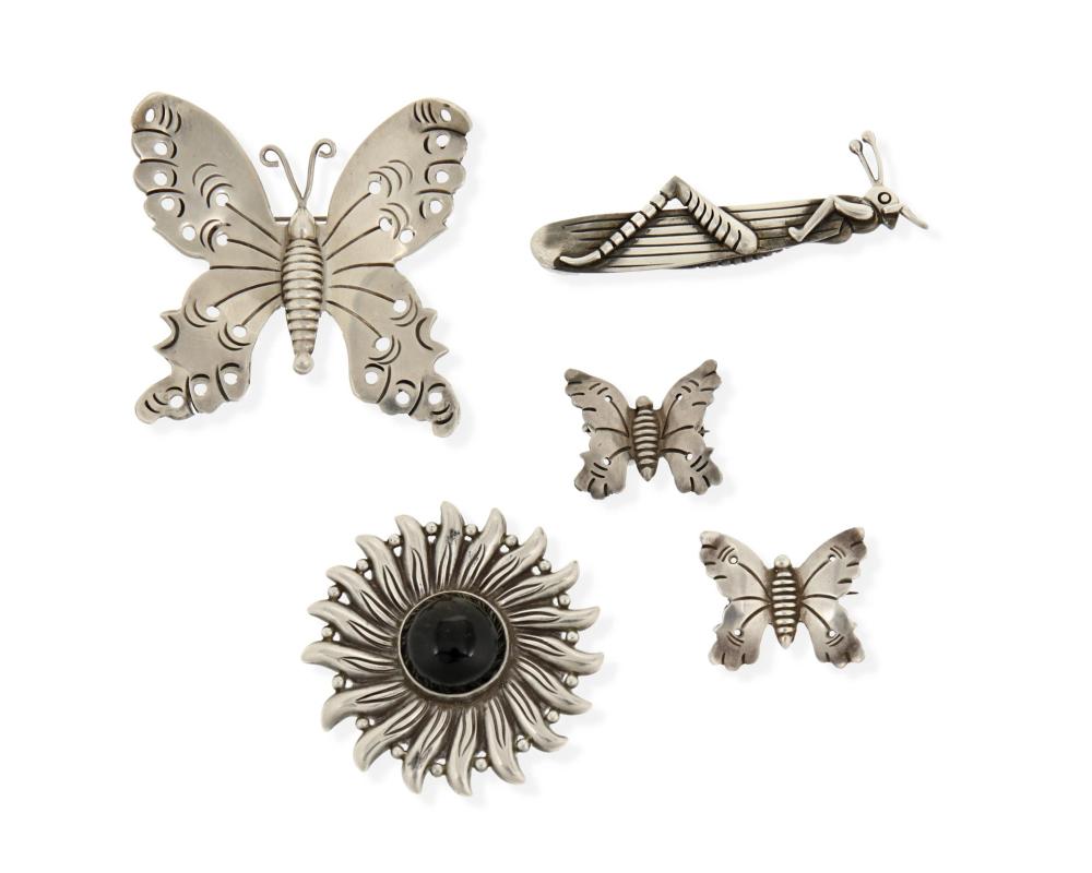 A GROUP OF SILVER BROOCHES BY