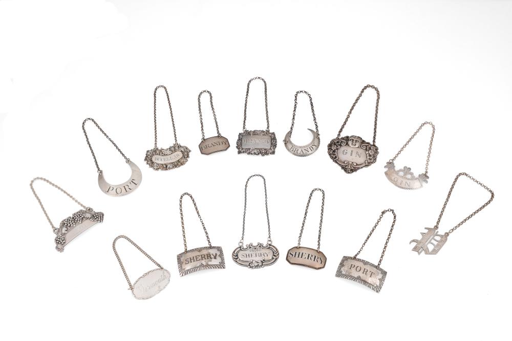 A GROUP OF STERLING SILVER LIQUOR