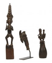 A Group of Three Carved Wood F