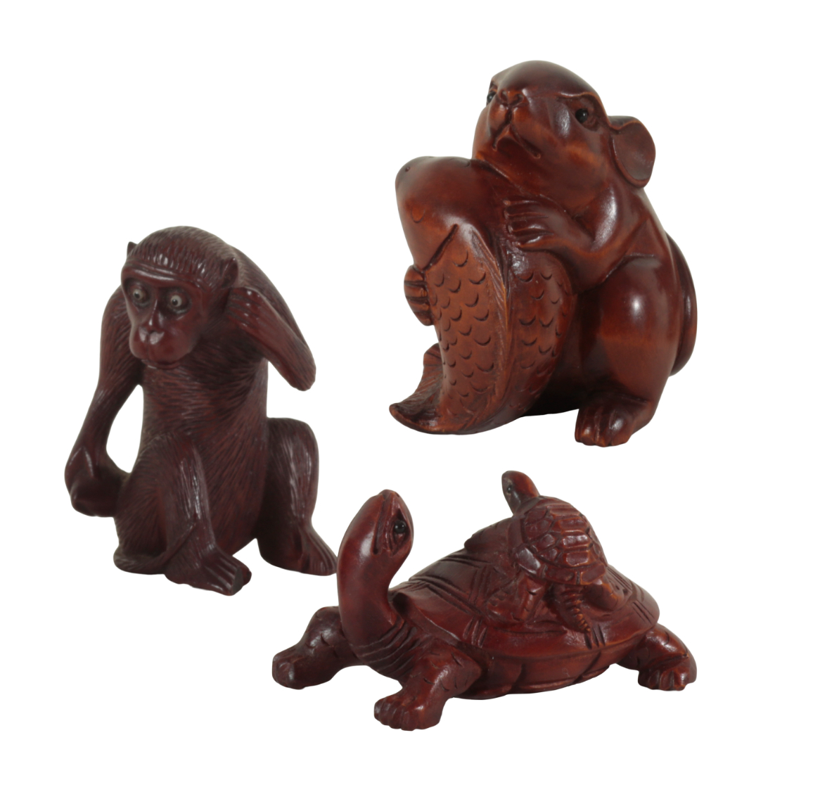 A GROUP OF THREE CARVED WOOD