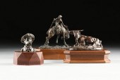 A GROUP OF THREE COWBOY AND LO