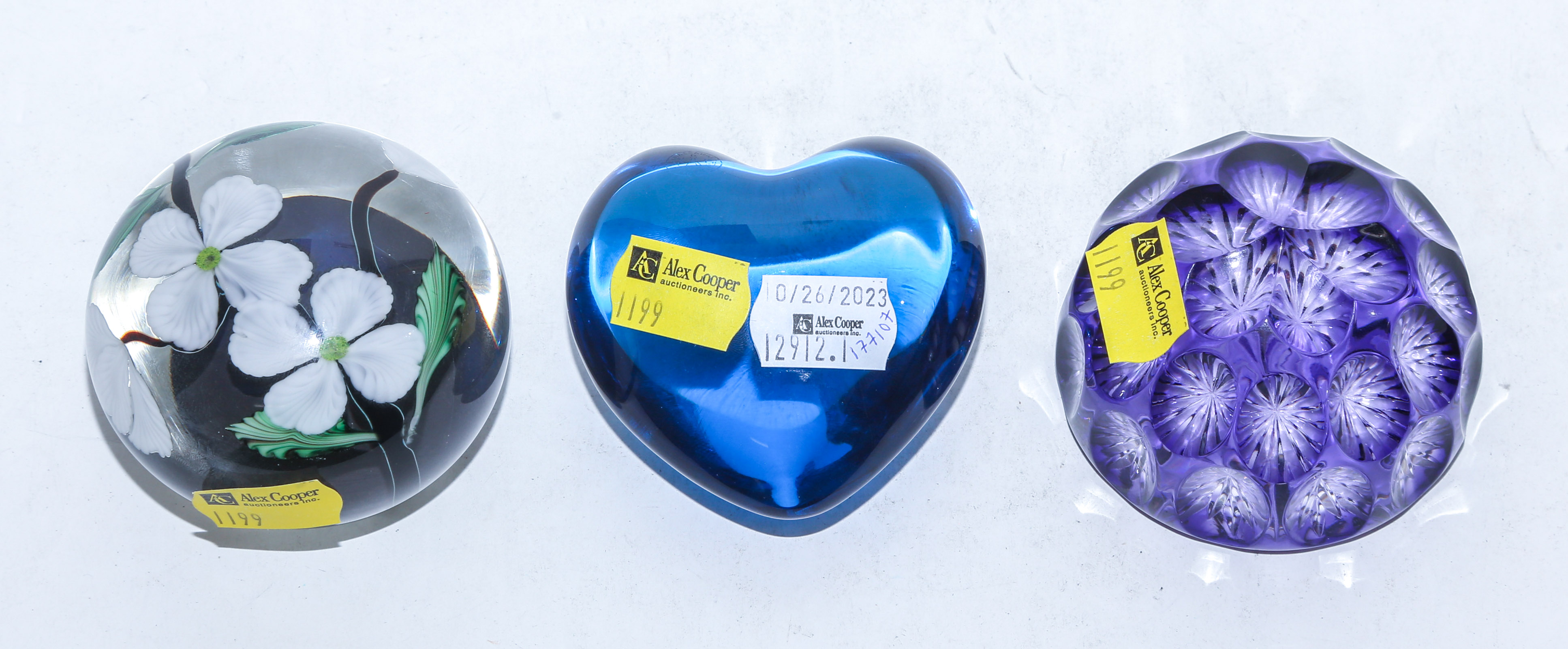 A GROUP OF THREE GLASS PAPERWEIGHTS