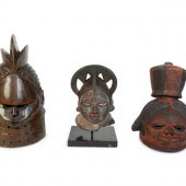 A Group of Three Helmet Masks