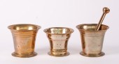 A GROUP OF THREE POLISHED BRON