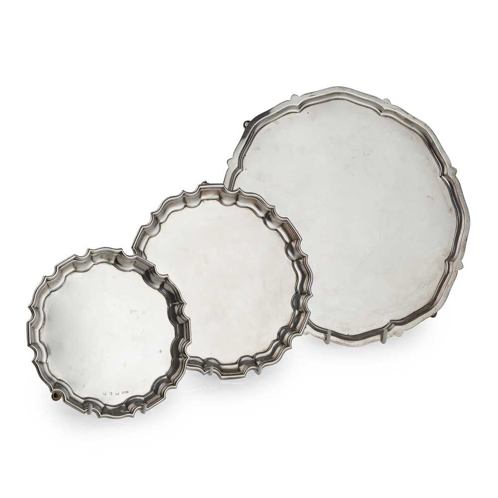 A GROUP OF THREE SALVERS AND