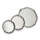 A GROUP OF THREE SALVERS AND T