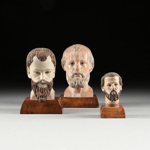A GROUP OF THREE SANTOS' HEADS,