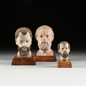 A GROUP OF THREE SANTOS' HEADS