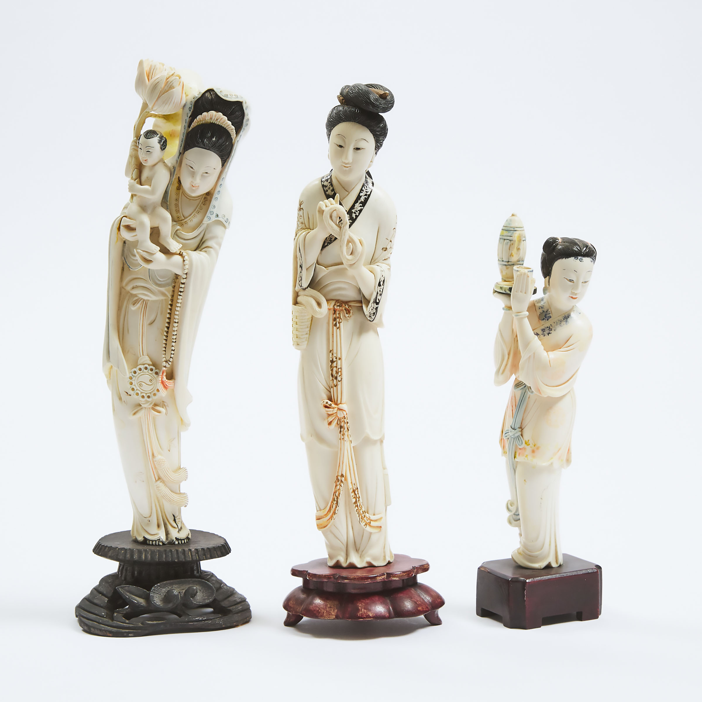 A Group of Three Tinted Ivory