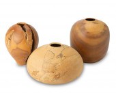 A GROUP OF TURNED WOOD VESSELS
