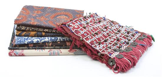 A Group of Twelve Batik Aprons of