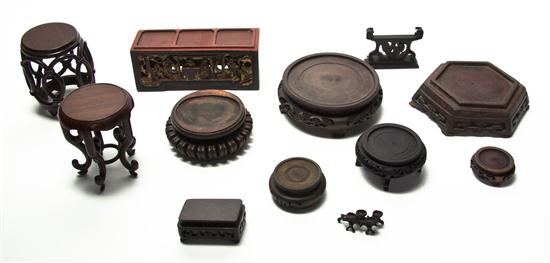 A Group of Twelve Carved Hardwood