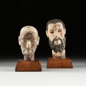 A GROUP OF TWO SANTOS' HEADS,