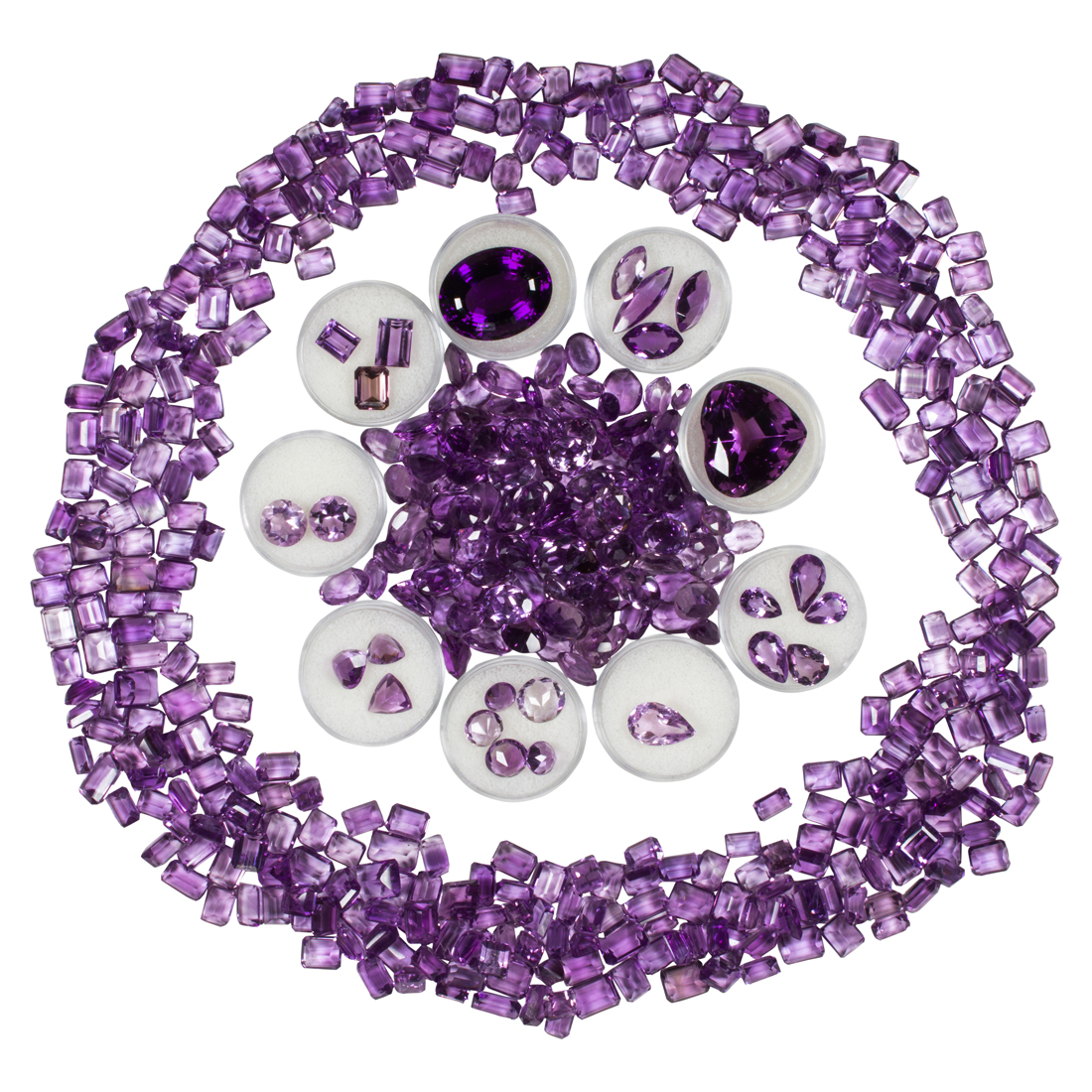 A GROUP OF UNMOUNTED AMETHYSTS A