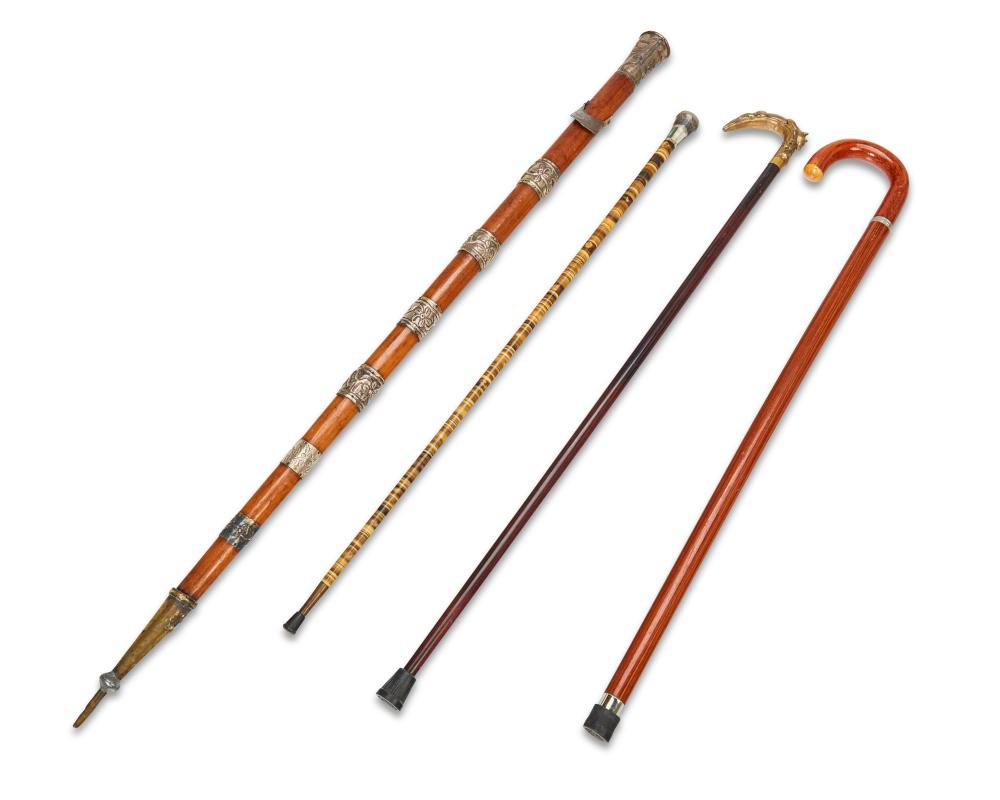 A GROUP OF WALKING STICKS AND