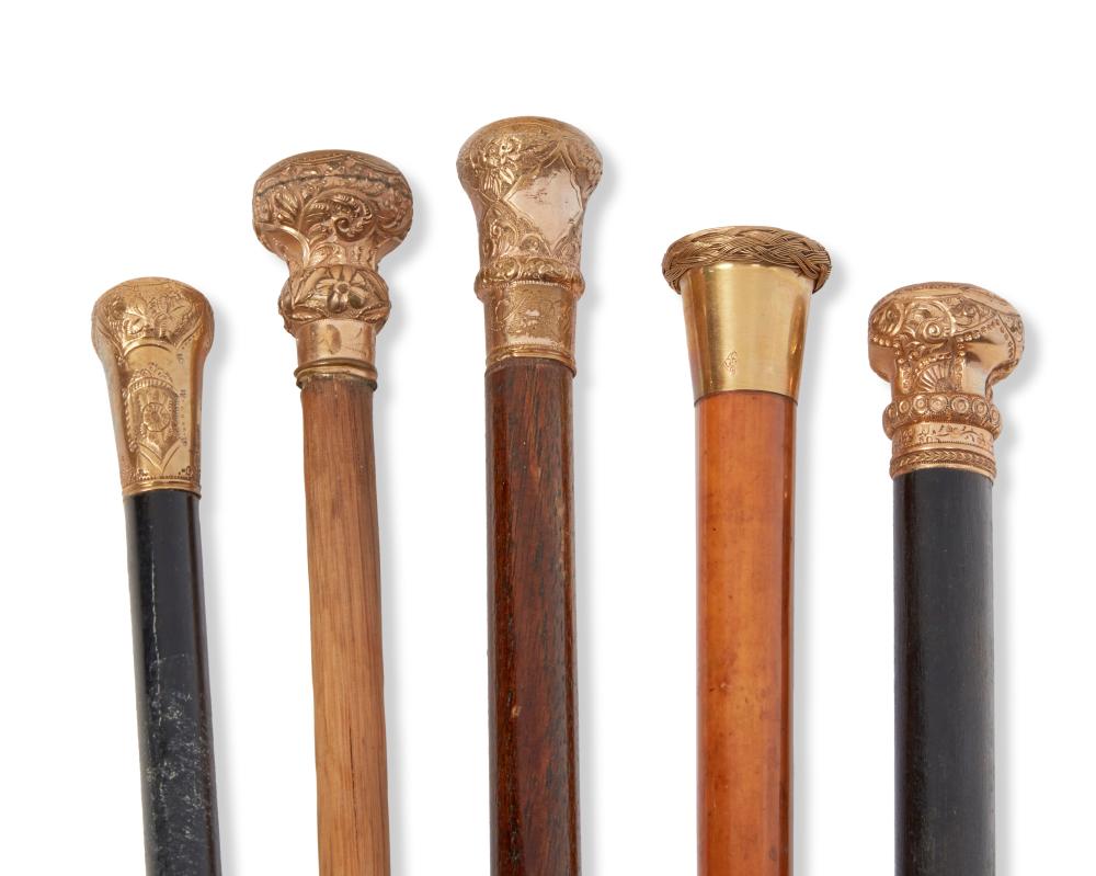 A GROUP OF WOOD WALKING CANESA