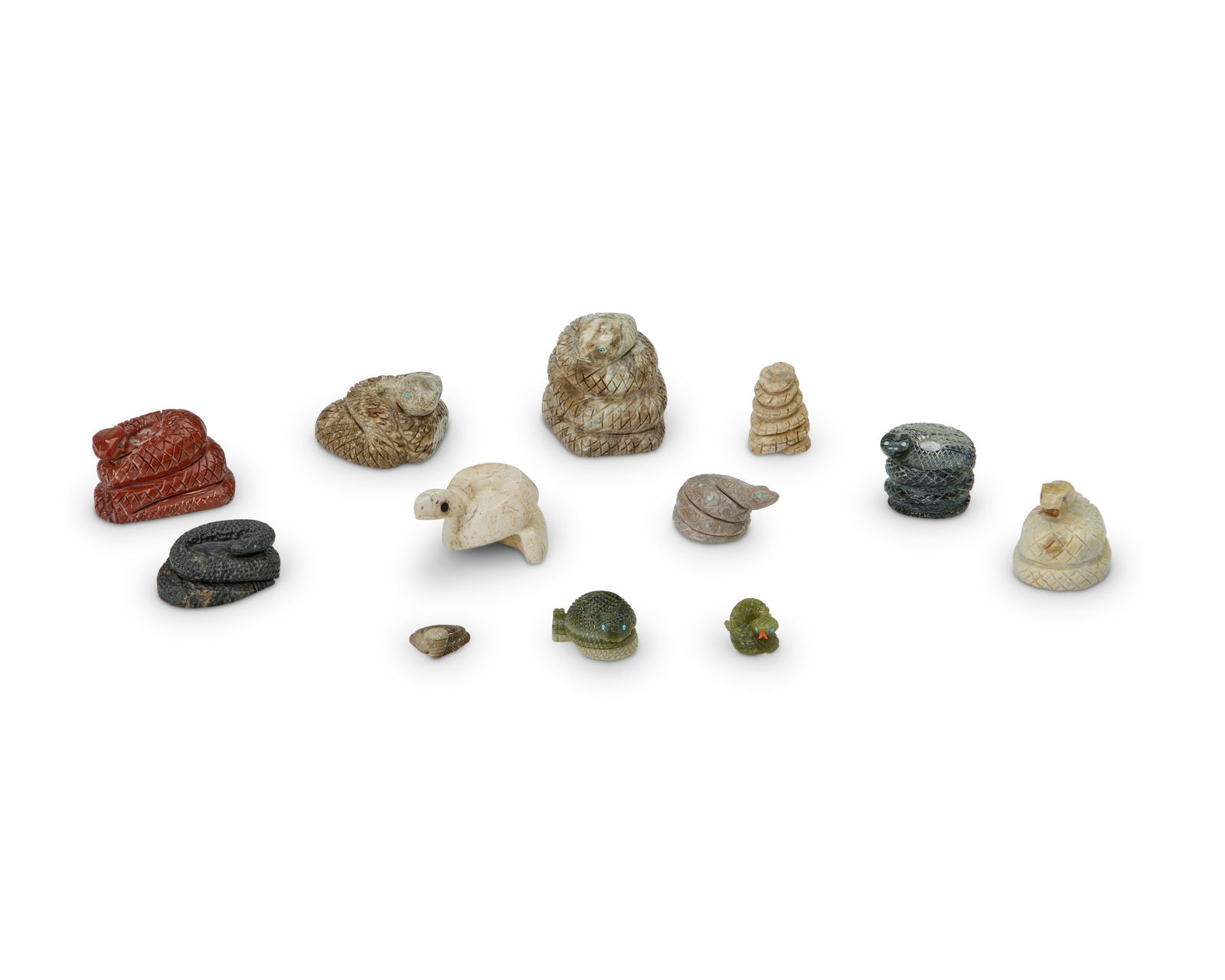 A GROUP OF ZUNI CARVED STONE COILED
