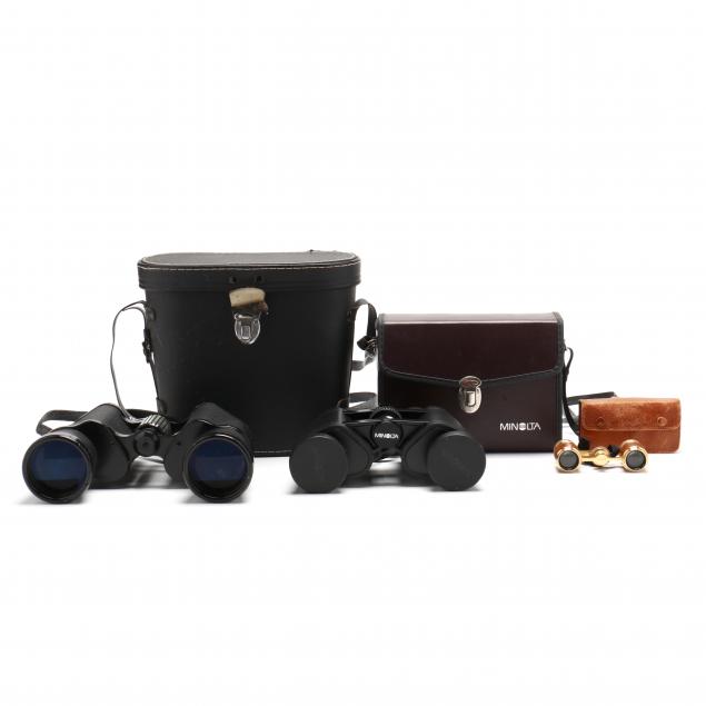 A GROUPING OF BINOCULARS AND