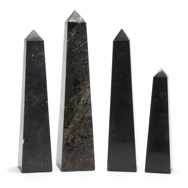 A GROUPING OF FOUR LARGE BLACK
