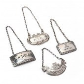 A GROUPING OF FOUR SILVER BOTT