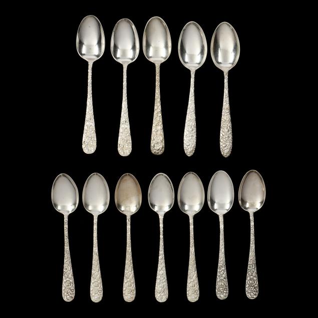 A GROUPING OF TWELVE FLORAL