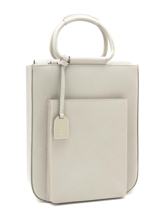 A Gucci Bone Leather Bag with metal