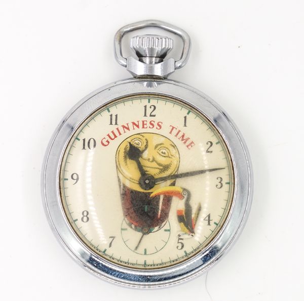 A GUINNESS TIME BASE METAL CASED,