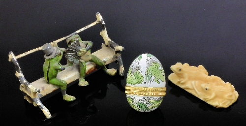A Halcyon Days enamel egg shaped