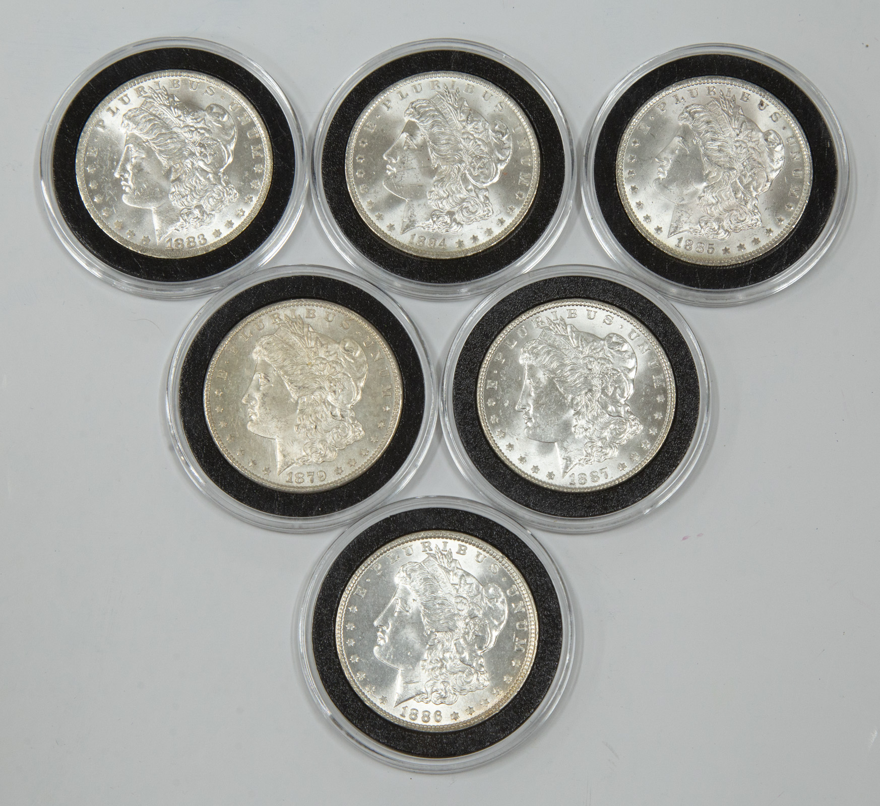A HALF DOZEN MINT STATE MORGAN
