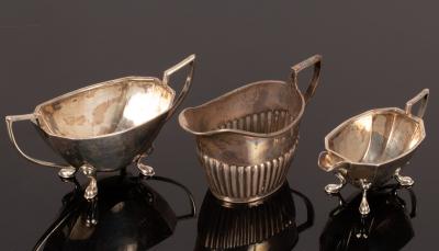 A half-ribbed silver cream jug,