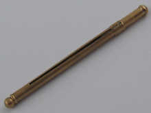 A hallmarked 9 carat gold swizzle