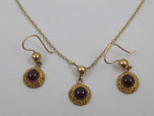 A hallmarked 9 ct gold suite of