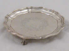 A hallmarked silver three footed