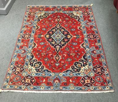 A Hamadan rug, the red ground