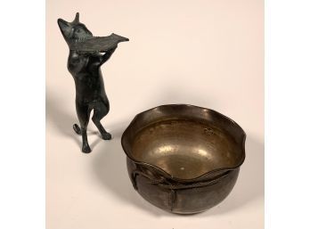A hammered brass censor with