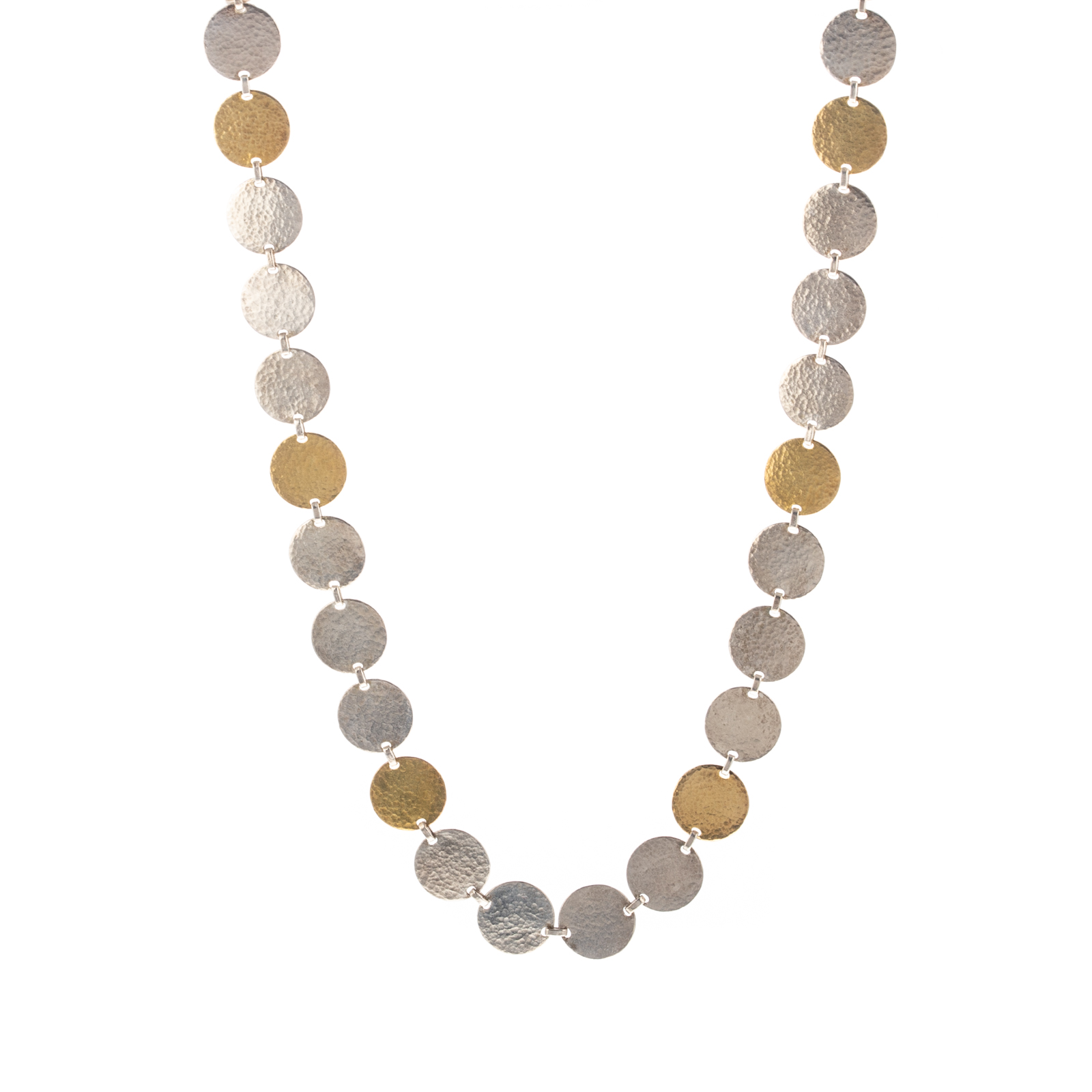 A HAMMERED TWO TONE STERLING