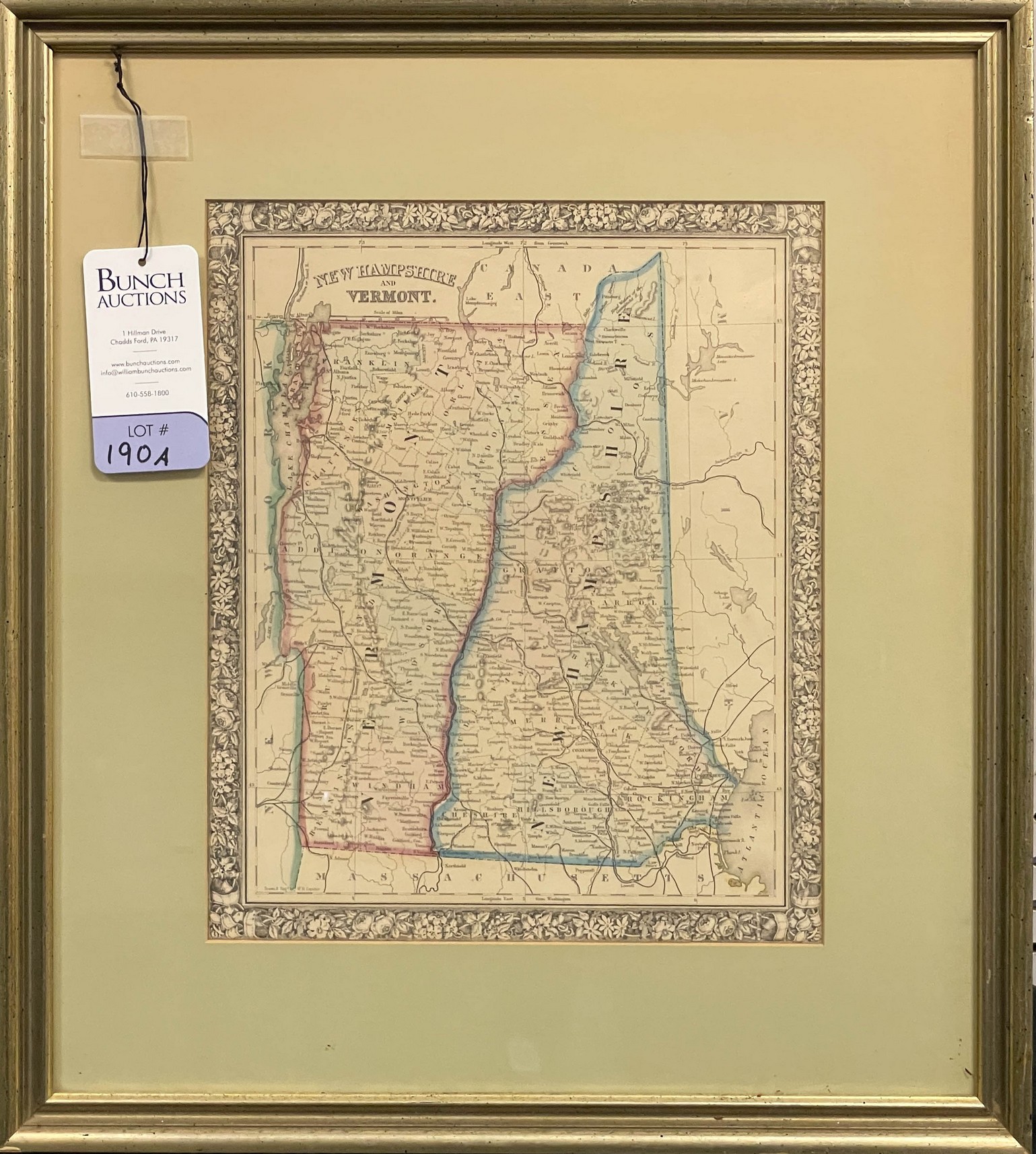 A hand colored framed map of
