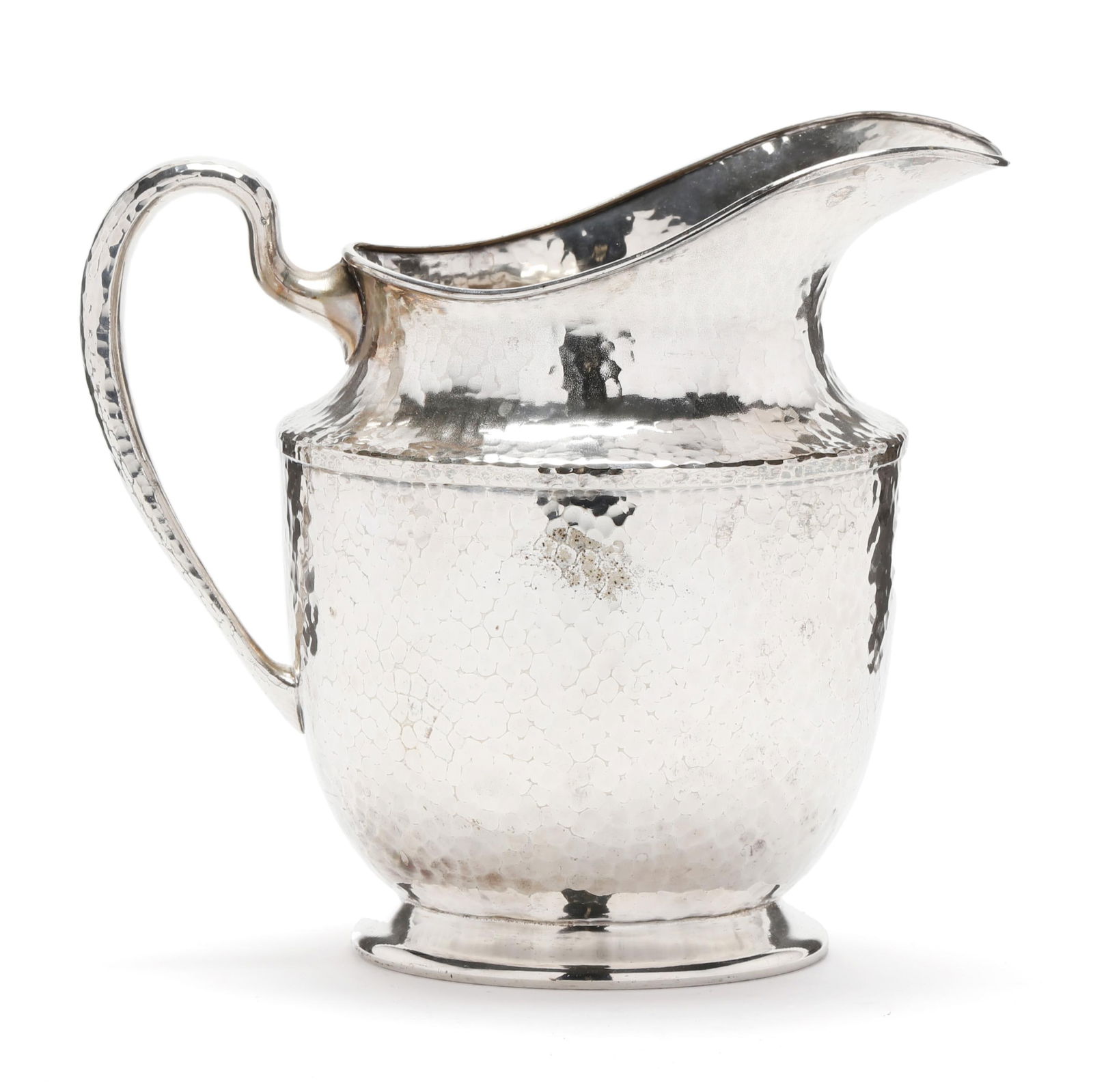 A HAND HAMMERED SILVER-PLATED WATER