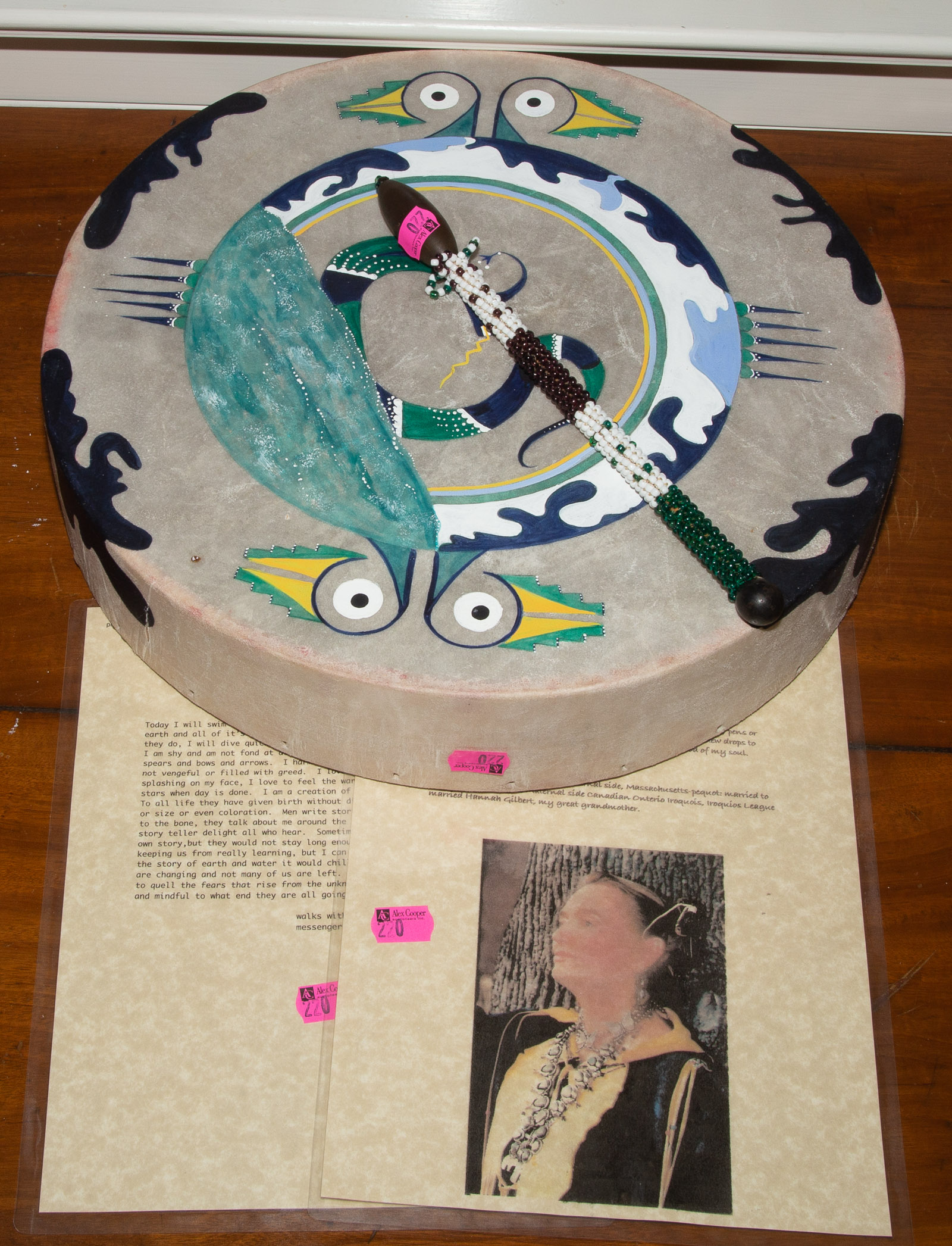 A HAND PAINTED DRUM With beaded