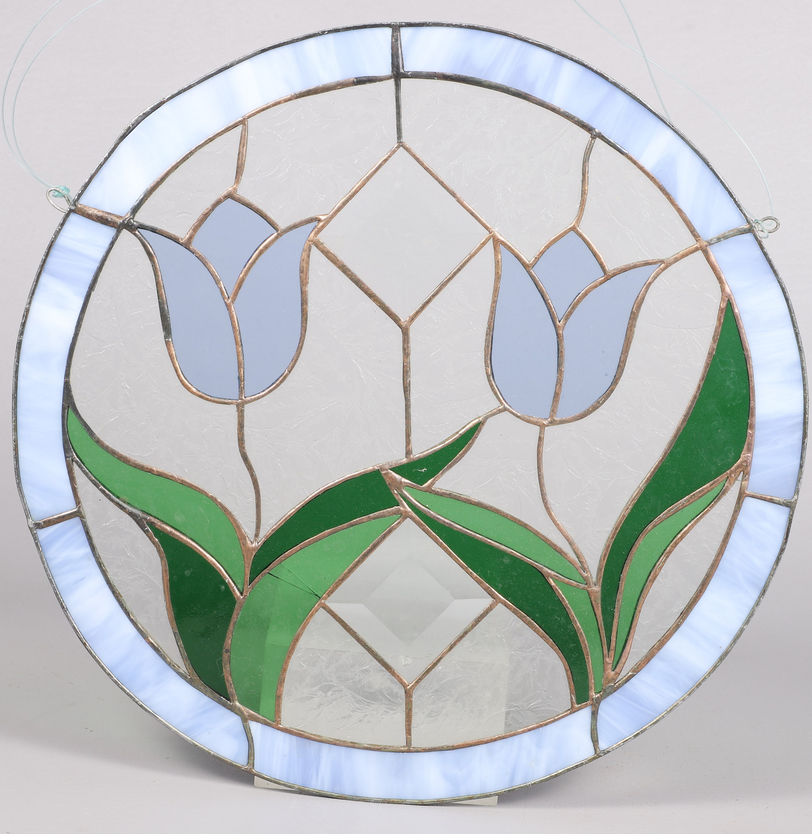 A hanging leaded glass window