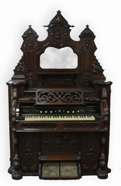 A harmonium with mirror back