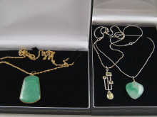 A heart shaped jade pendant on a