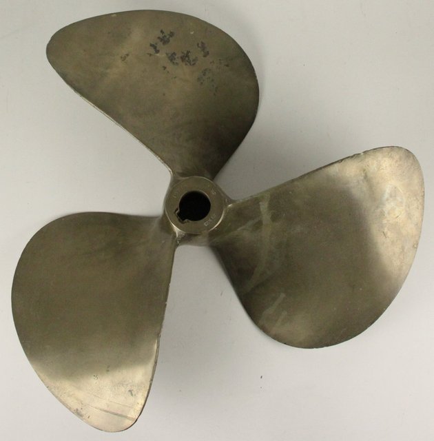 A heavy brass propeller three