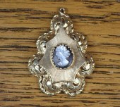 A HEAVY CAMEO AND GOLD LOCKET