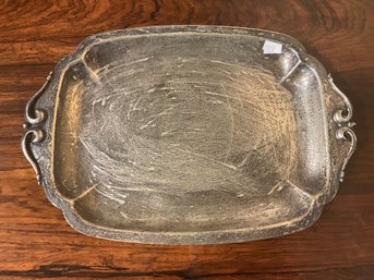 A heavy dish marked Cellini Craft