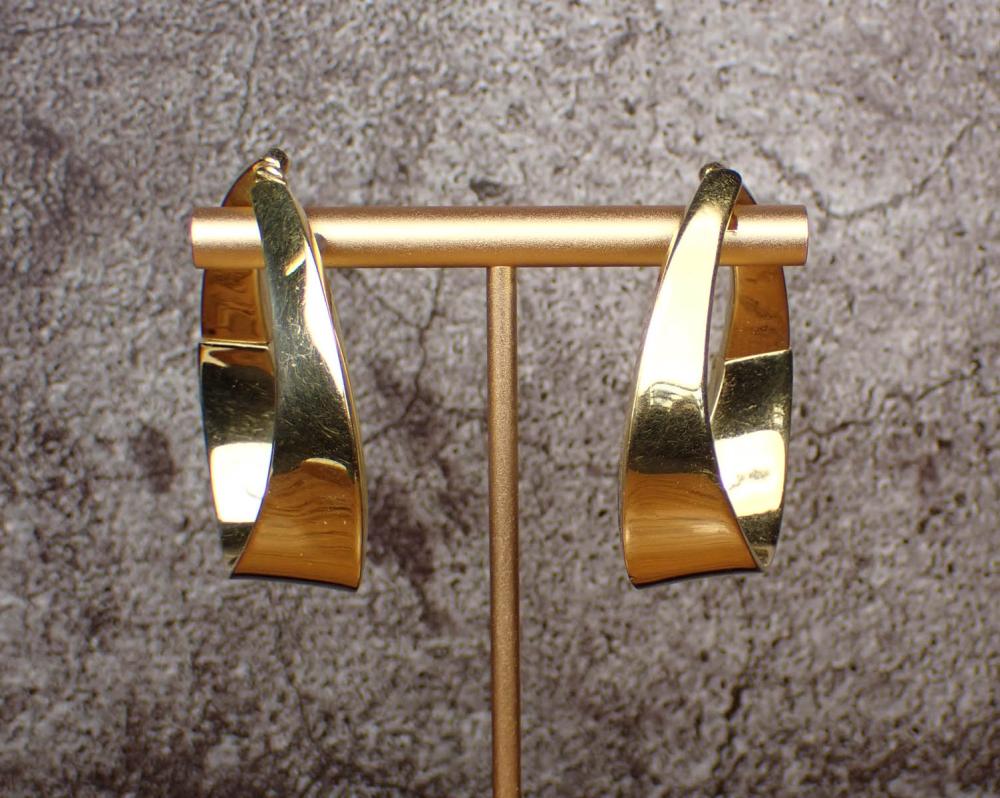 A HEAVY PAIR OF GOLD HOOP EAR