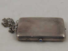 A heavy silver compact on