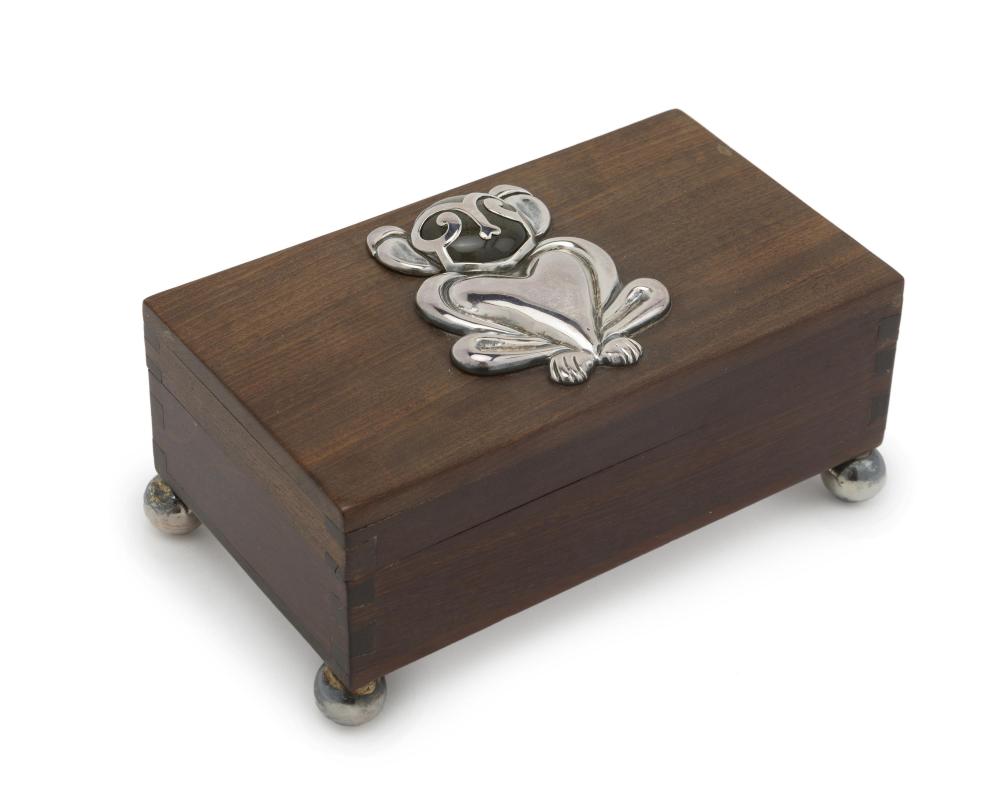 A HECTOR AGUILAR WOOD AND SILVER